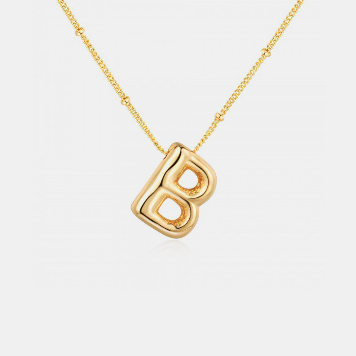 Gold-Plated Letter Pendant Necklace featuring a personalized letter charm on a delicate chain.