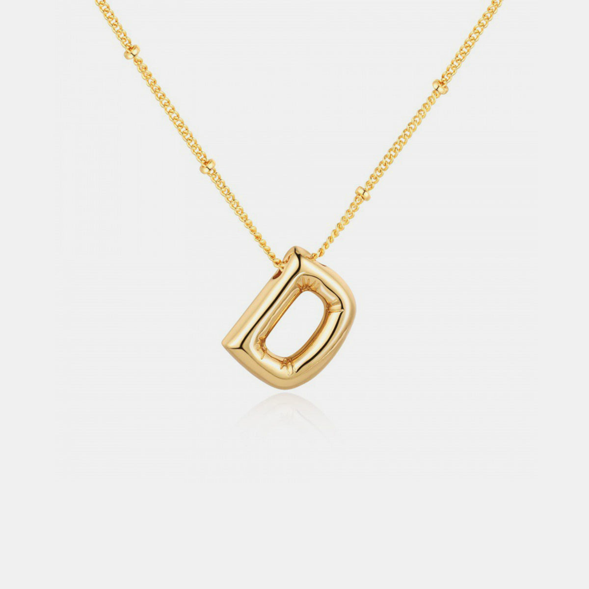 Gold-Plated Letter Pendant Necklace featuring a personalized letter charm on a delicate chain.