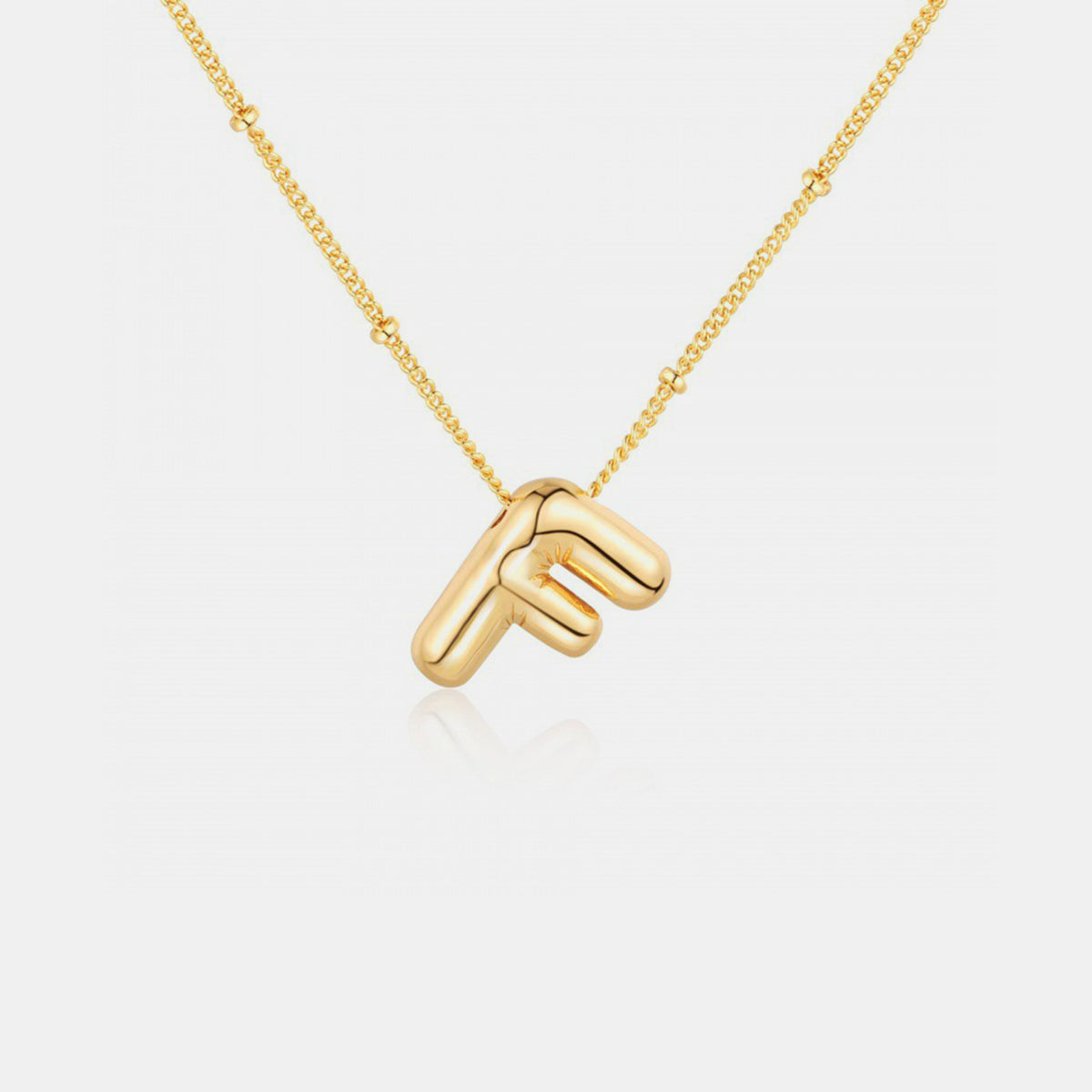 Gold-Plated Letter Pendant Necklace featuring a personalized letter charm on a delicate chain.