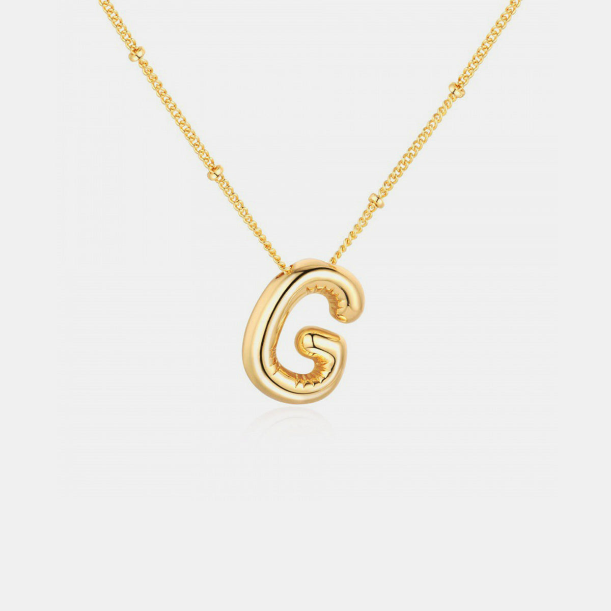 Gold-Plated Letter Pendant Necklace featuring a personalized letter charm on a delicate chain.