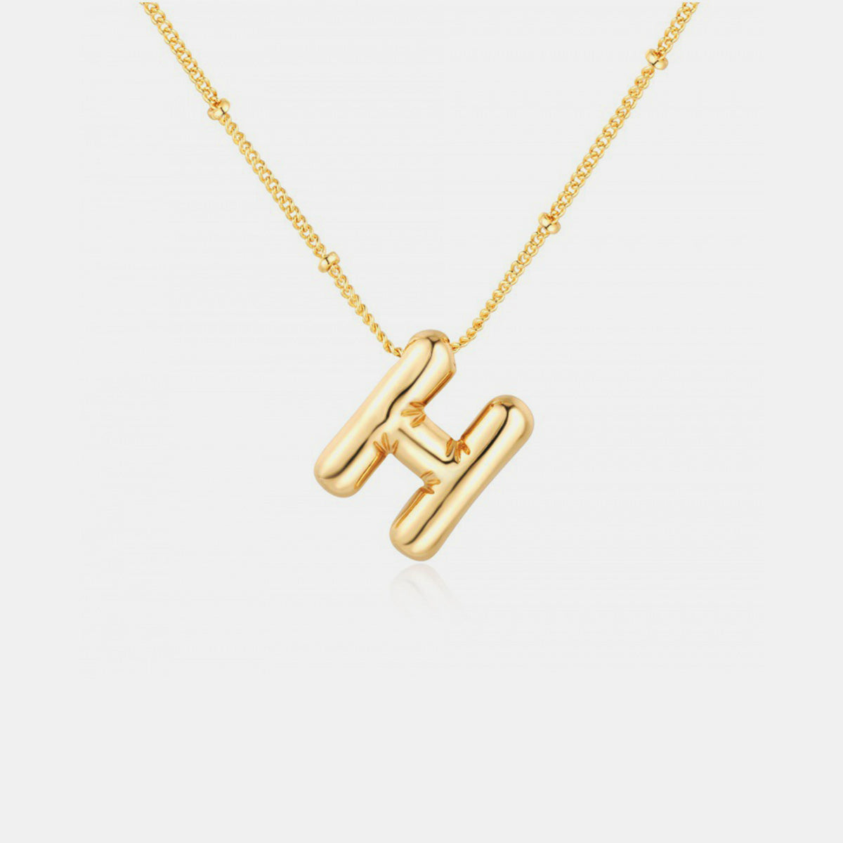 Gold-Plated Letter Pendant Necklace featuring a personalized letter charm on a delicate chain.