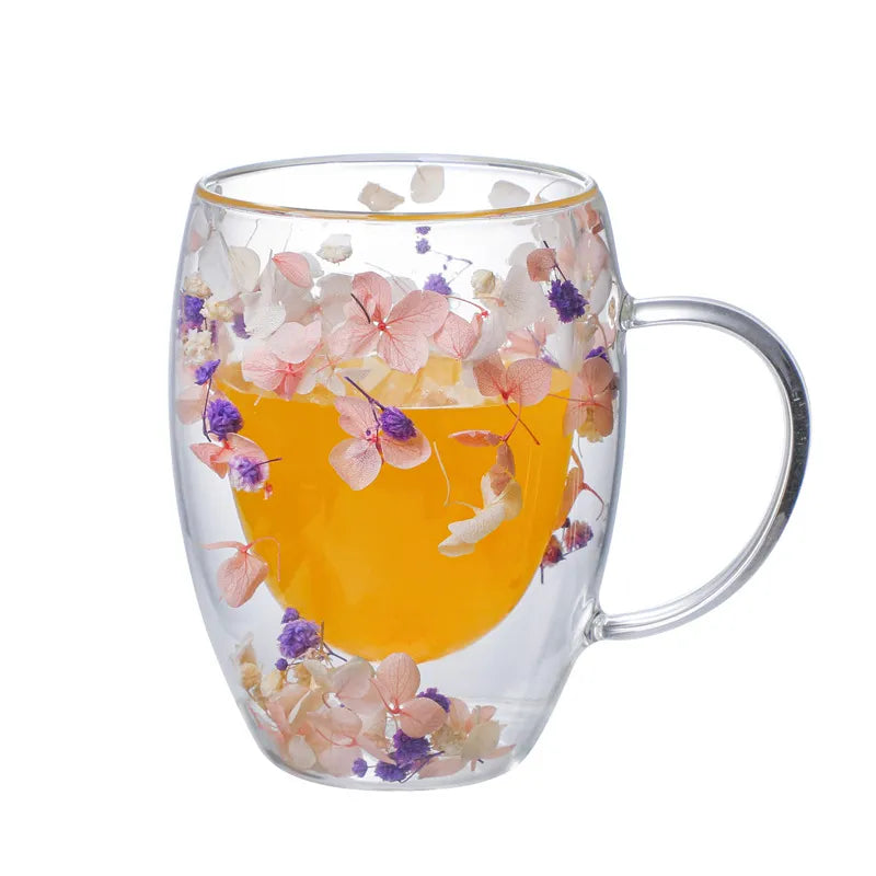 A set of Gorgeous High End Borosilicate Glass Cups with Handle featuring floral and shell designs, showcasing their elegant round shape and transparent glass.