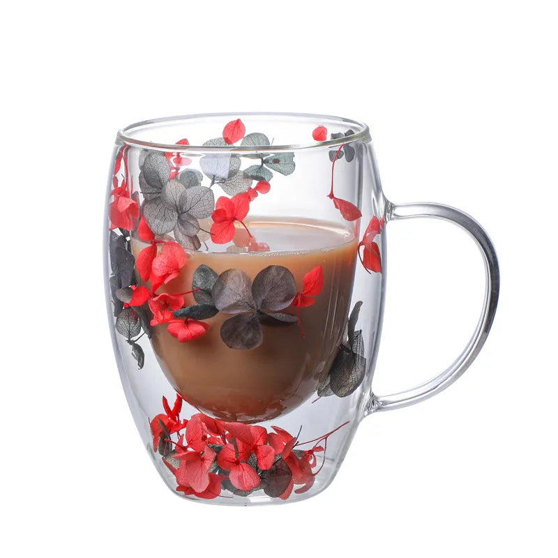 A set of Gorgeous High End Borosilicate Glass Cups with Handle featuring floral and shell designs, showcasing their elegant round shape and transparent glass.