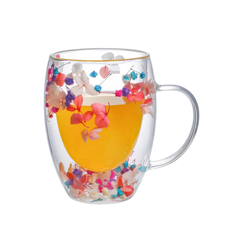 A set of Gorgeous High End Borosilicate Glass Cups with Handle featuring floral and shell designs, showcasing their elegant round shape and transparent glass.