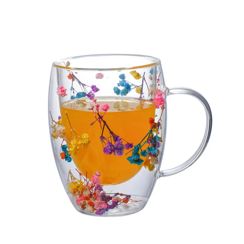 A set of Gorgeous High End Borosilicate Glass Cups with Handle featuring floral and shell designs, showcasing their elegant round shape and transparent glass.