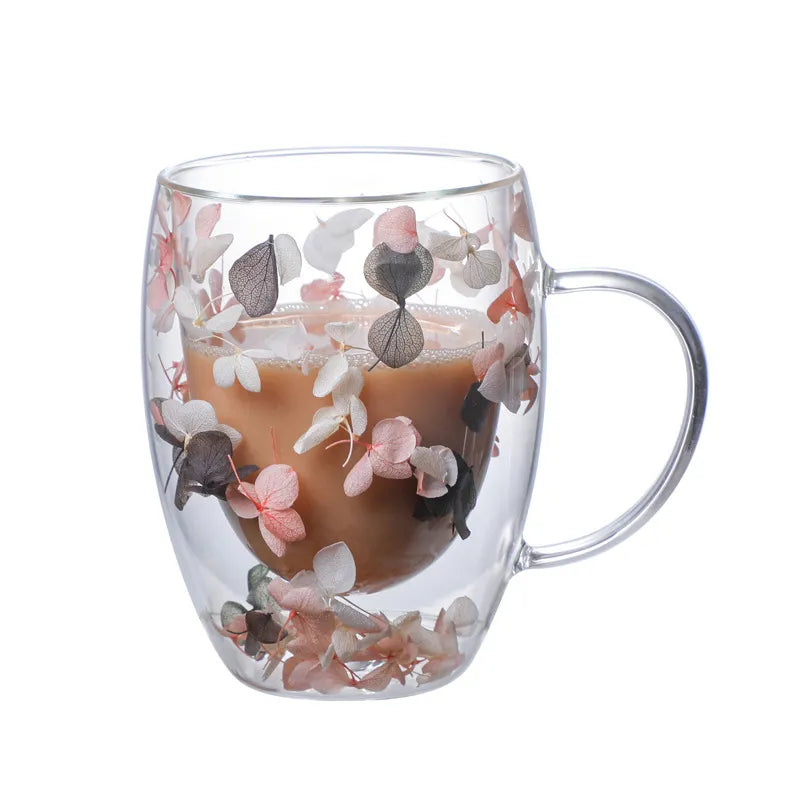 A set of Gorgeous High End Borosilicate Glass Cups with Handle featuring floral and shell designs, showcasing their elegant round shape and transparent glass.