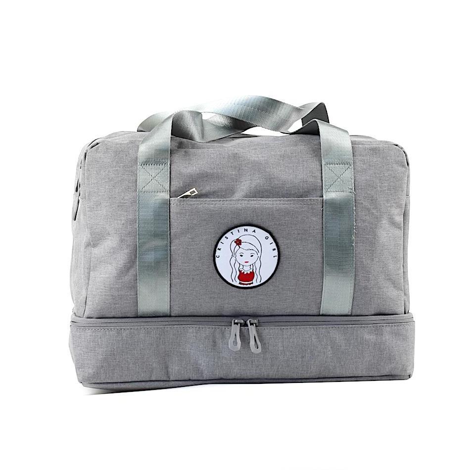 A spacious gym bag with a shoe compartment, featuring multiple zipped pockets and a stylish design, perfect for workouts and travel.