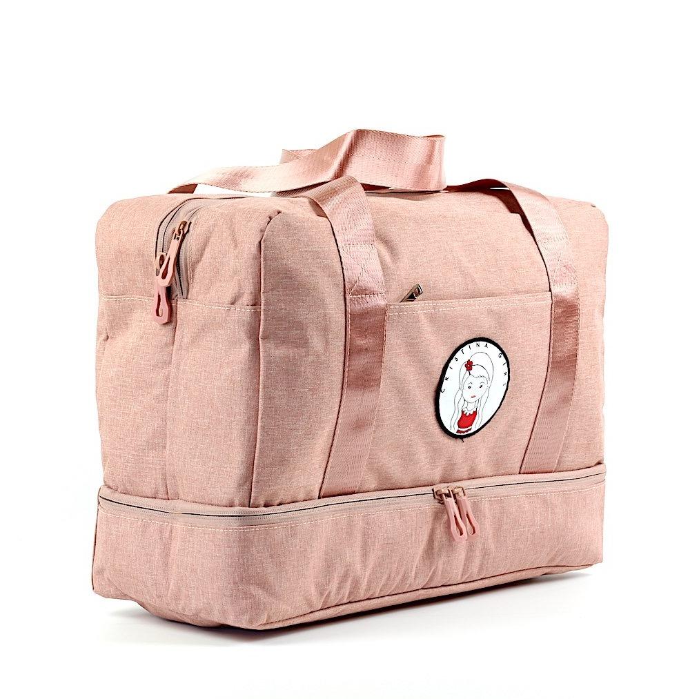 A spacious gym bag with a separate shoe compartment, featuring multiple zipped pockets and a stylish design.