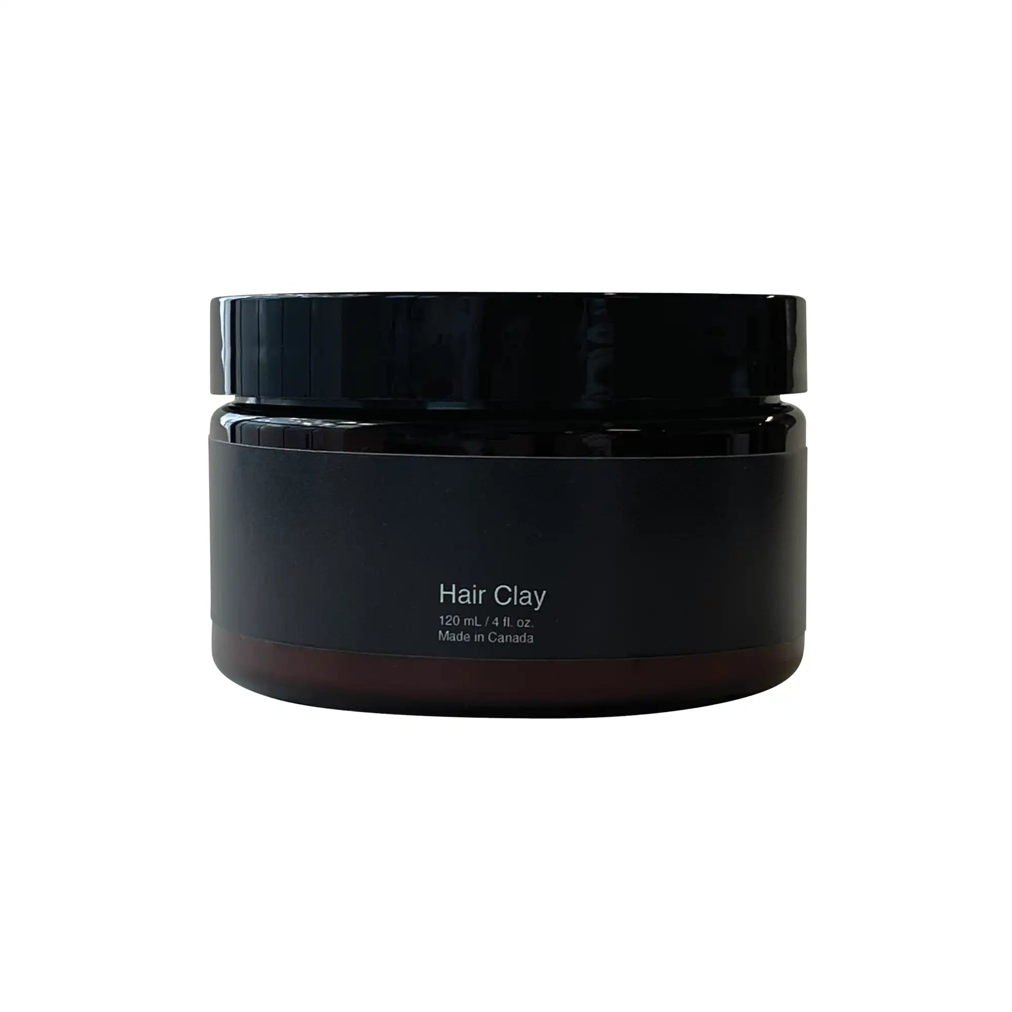 A jar of Hair Clay with a matte finish, showcasing its natural styling capabilities and nourishing ingredients.