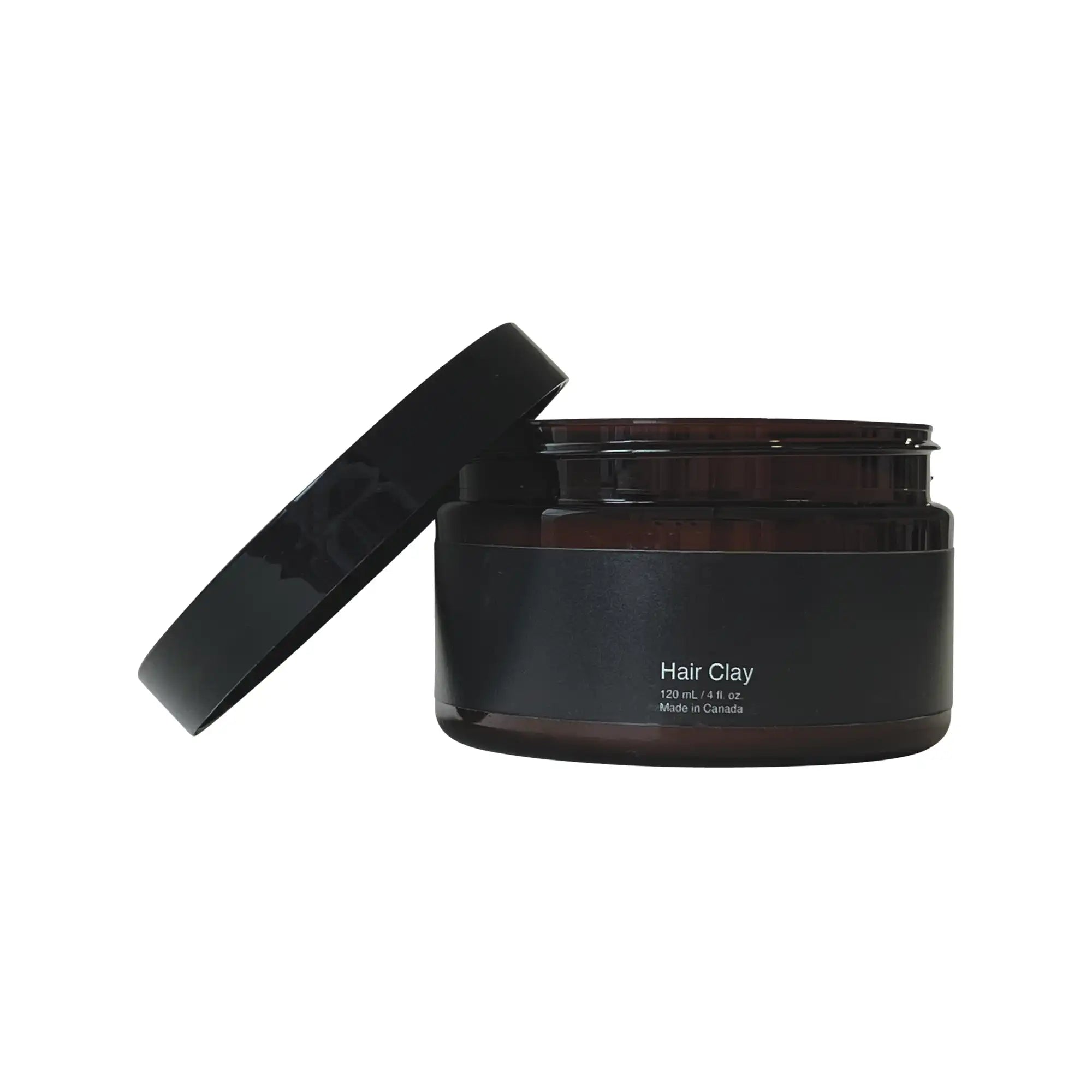 A jar of Hair Clay with a matte finish, showcasing its natural styling capabilities and nourishing ingredients.