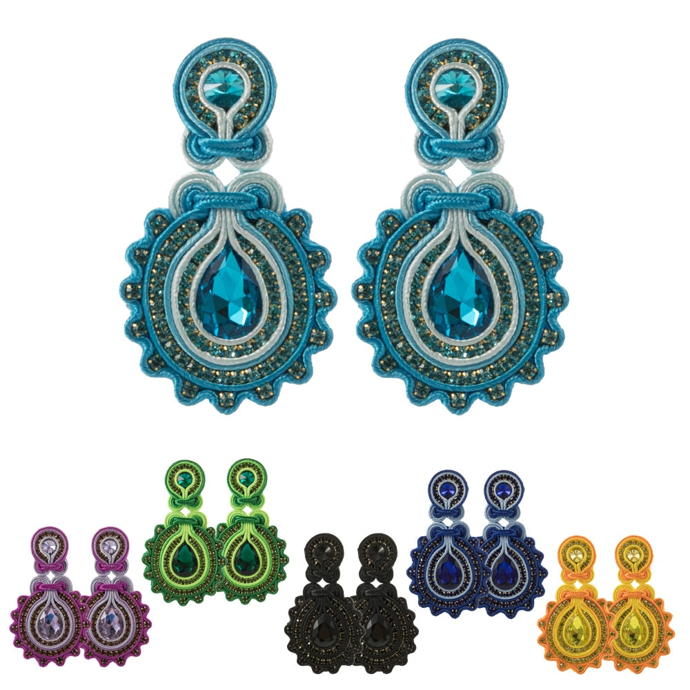 A pair of elegant handmade soutache earrings featuring a water drop design, available in various colors including white, black, and blue.