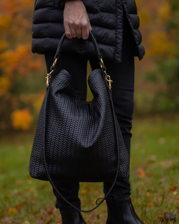 Handmade Woven Original Leather Bag in black, showcasing intricate weaving and durable metal hardware.