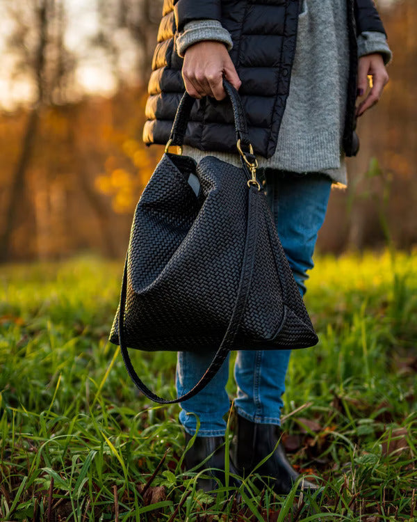 Handmade Woven Original Leather Bag in black, showcasing intricate weaving and durable metal hardware.