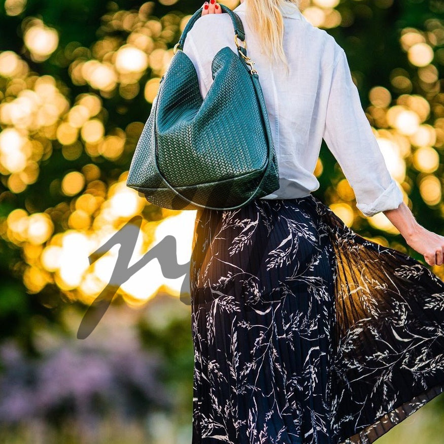 Handmade Woven Original Leather Bag in Green, showcasing intricate weaving and a stylish design with a top handle and detachable shoulder strap.