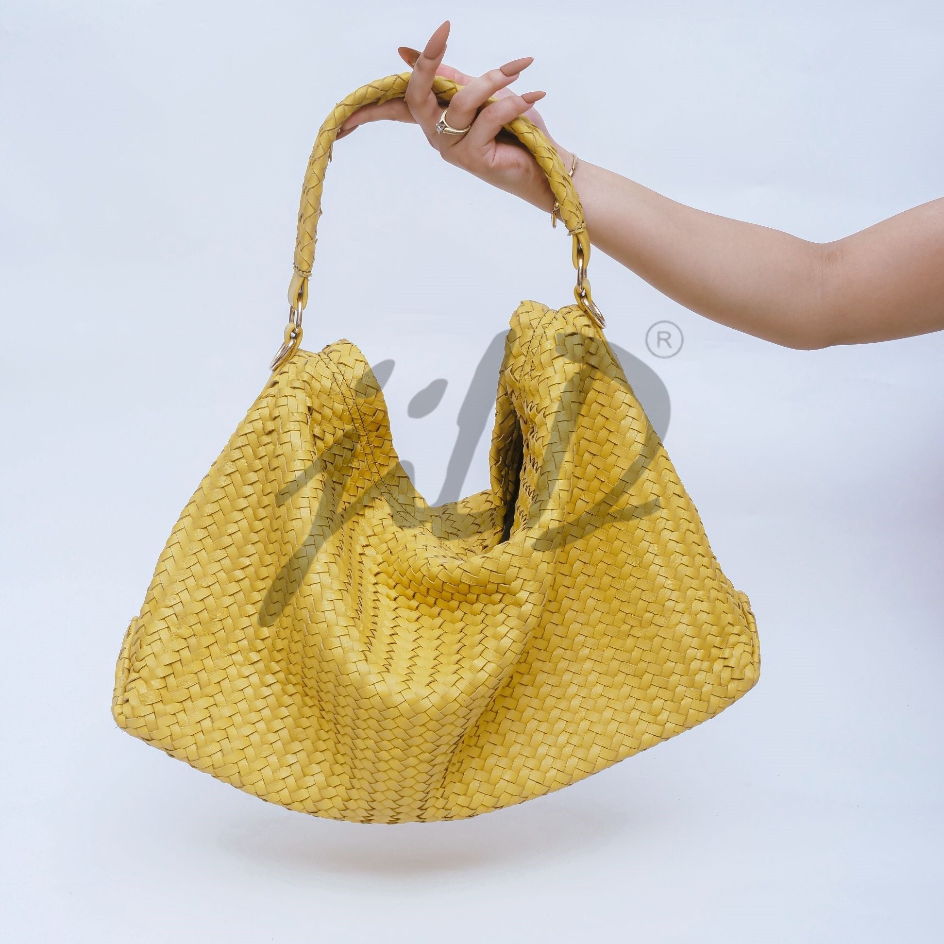 Handmade Woven Original Leather Bag in Yellow, showcasing intricate weaving and a stylish design with a top handle and detachable shoulder strap.