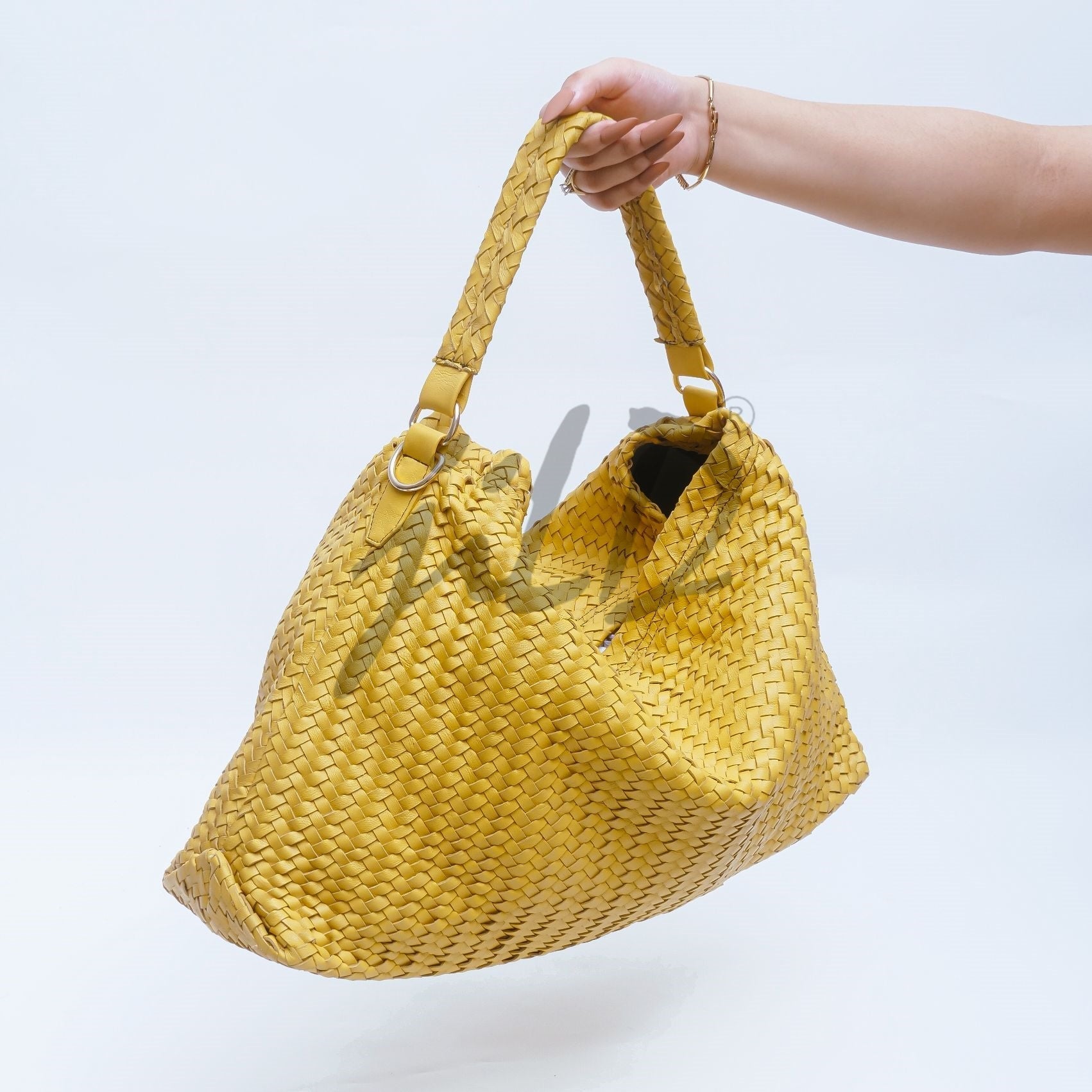 Handmade Woven Original Leather Bag in Yellow, showcasing intricate weaving and a stylish design with a top handle and detachable shoulder strap.