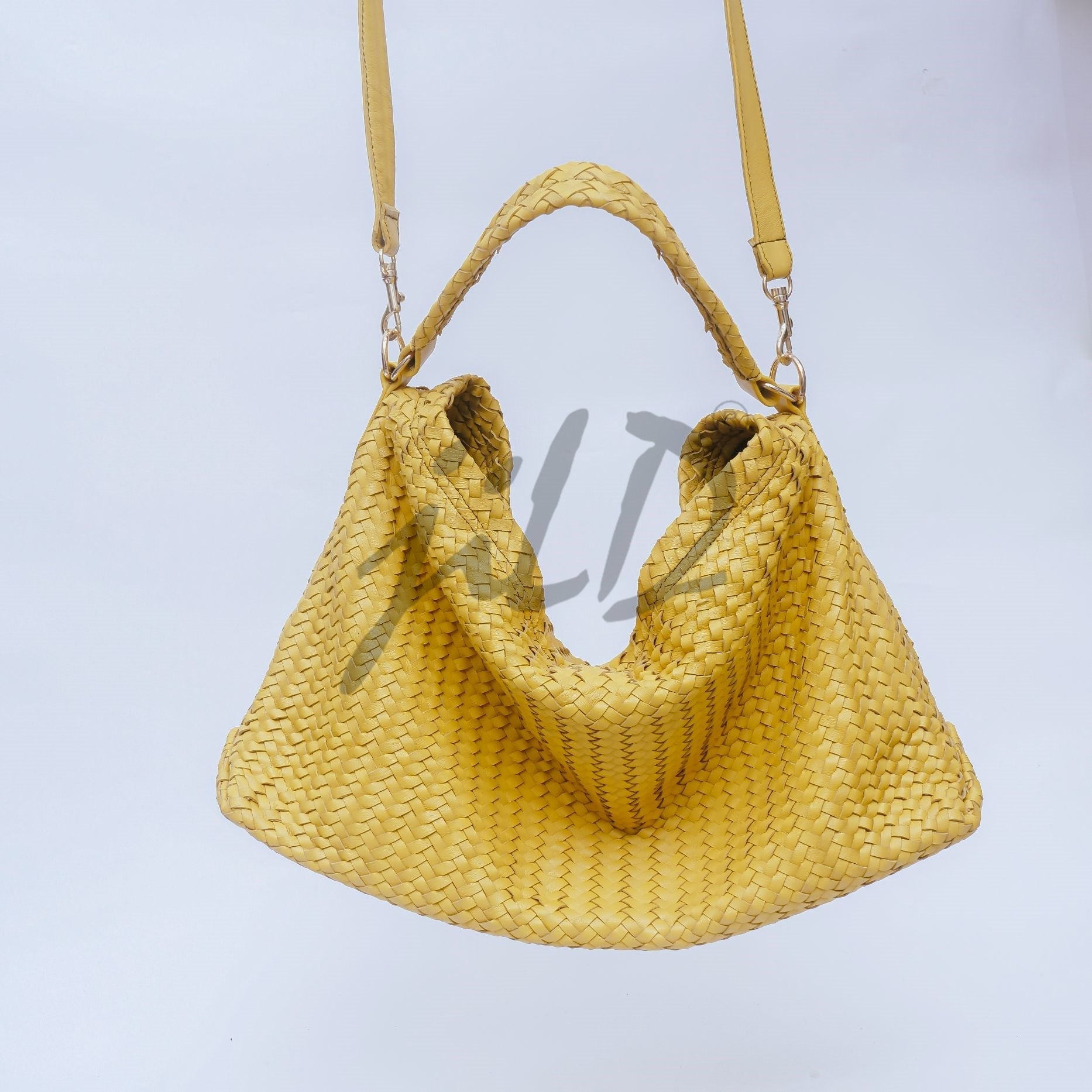 Handmade Woven Original Leather Bag in Yellow, showcasing intricate weaving and a stylish design with a top handle and detachable shoulder strap.