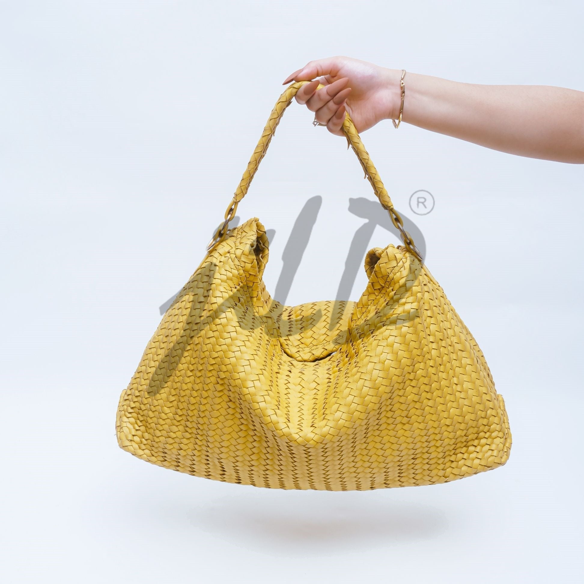 Handmade Woven Original Leather Bag in Yellow, showcasing intricate weaving and a stylish design with a top handle and detachable shoulder strap.