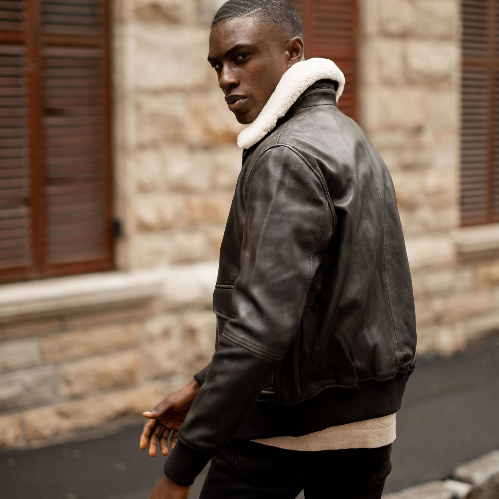 Black Harry Bomber Jacket featuring a classic cut, cold-defying collar, and multiple pockets for convenience.