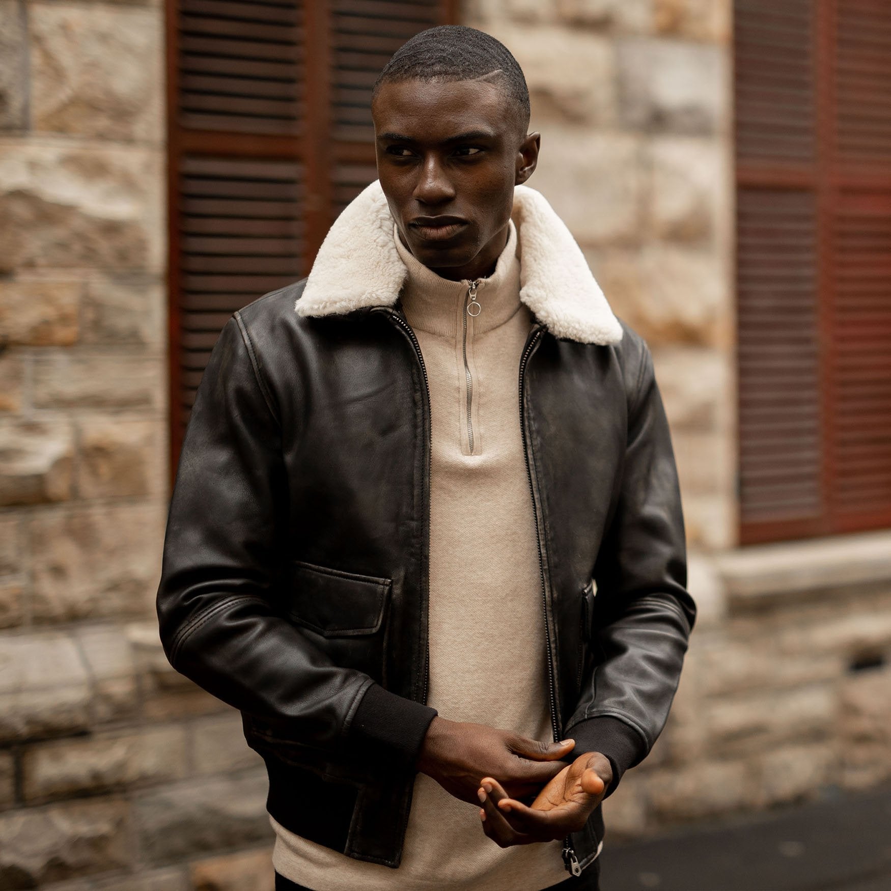 Black Harry Bomber Jacket featuring a classic cut, cold-defying collar, and multiple pockets for convenience.