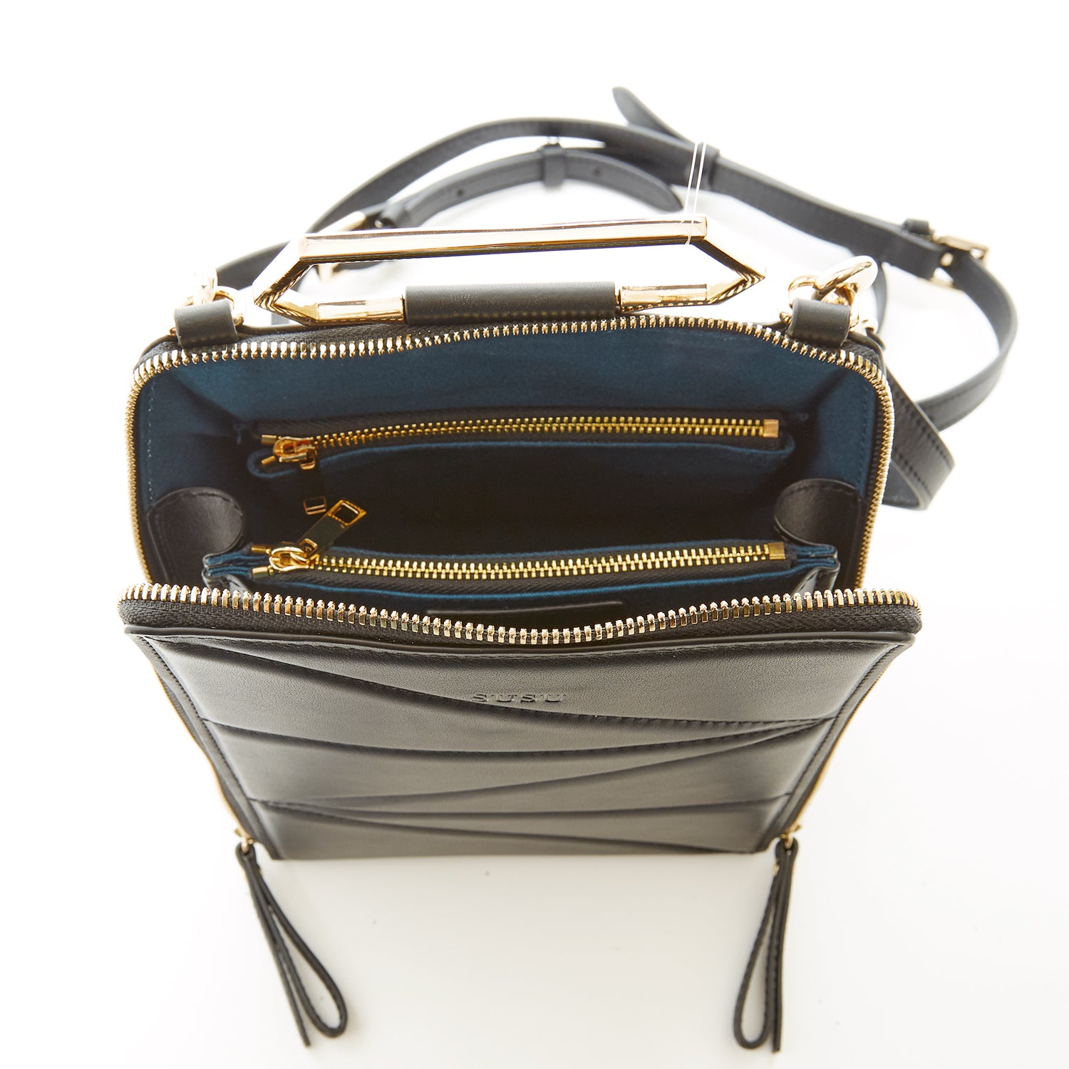 Heidi Black Leather Backpack Purse showcasing its stylish design, gold hardware, and teal interior.