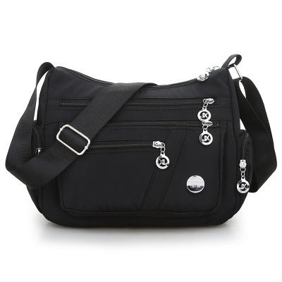 High Quality Nylon Fabric Women's Messenger Bag in dumpling shape, featuring a zipper opening and multiple pockets, perfect for stylish everyday use.