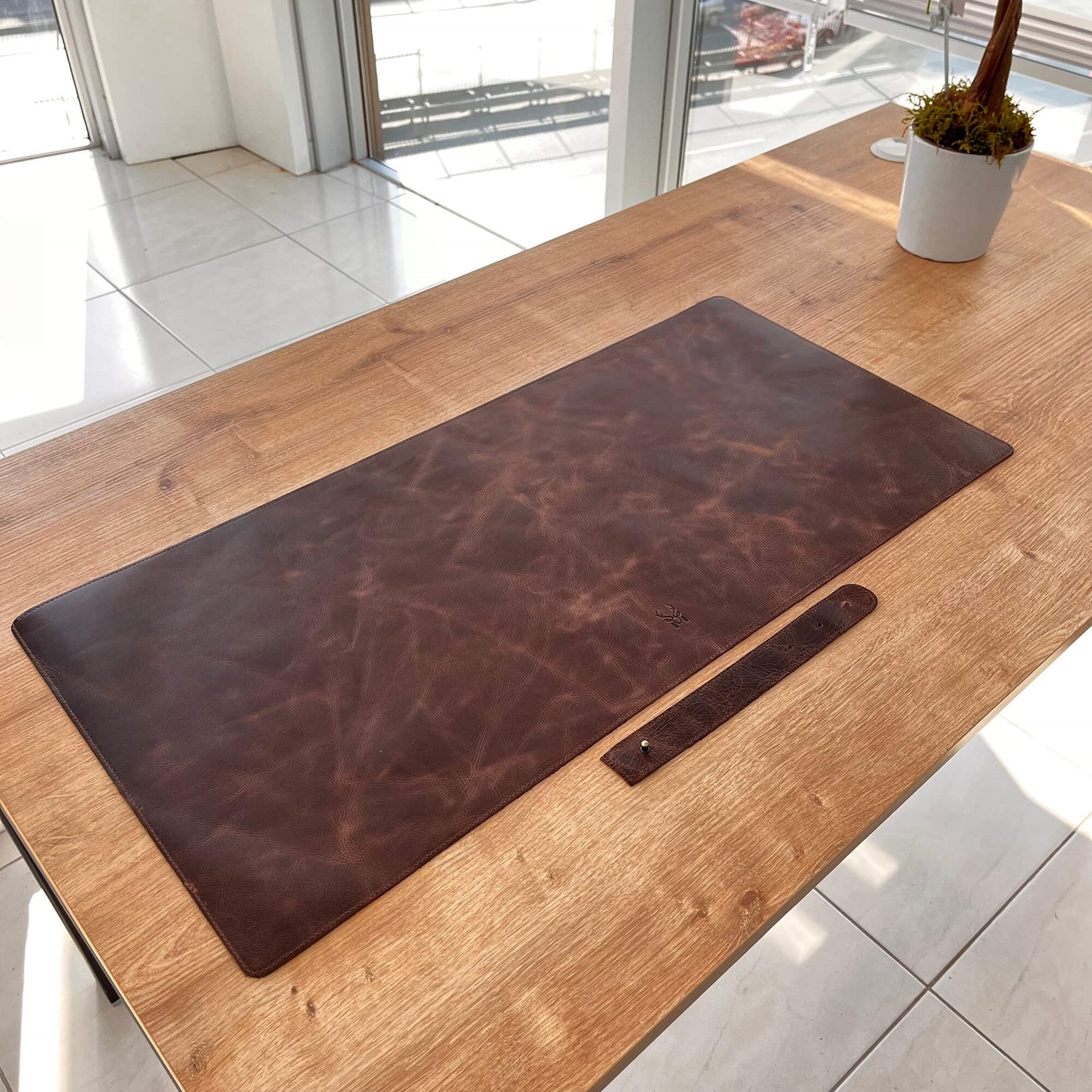 Hobart Genuine Leather Luxury Desk Mat showcasing its elegant design and smooth surface, perfect for enhancing any workspace.