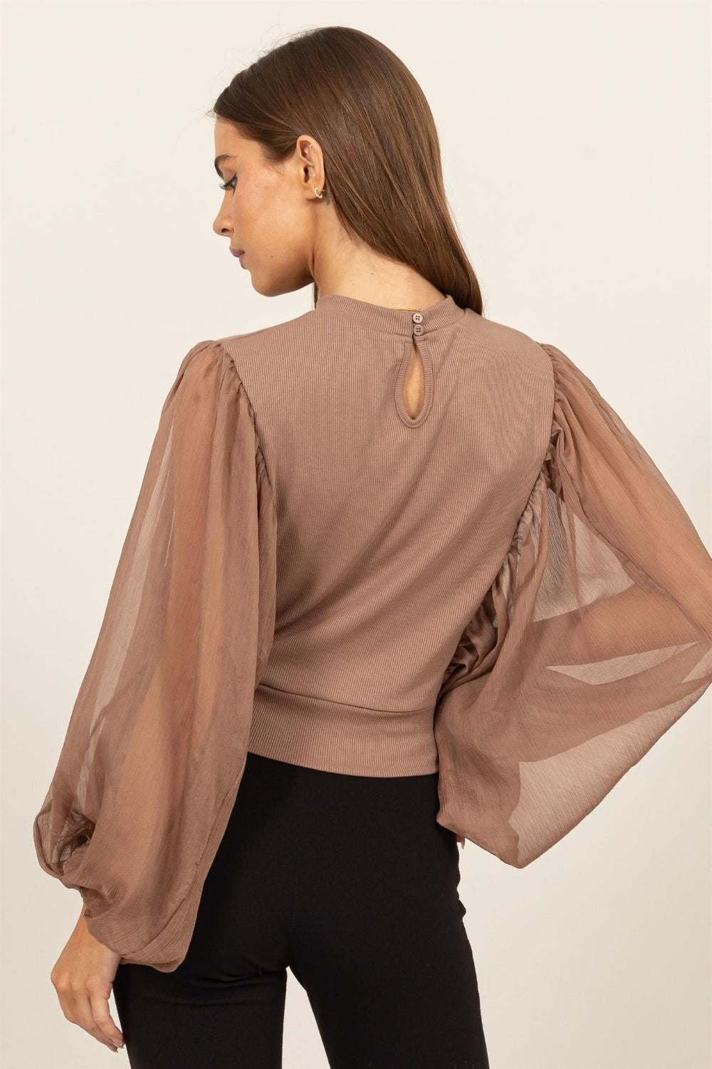 HYFVE Ruched Sheer Long Sleeve Mock Neck Blouse featuring delicate sheer sleeves and a back button closure, perfect for casual and formal occasions.