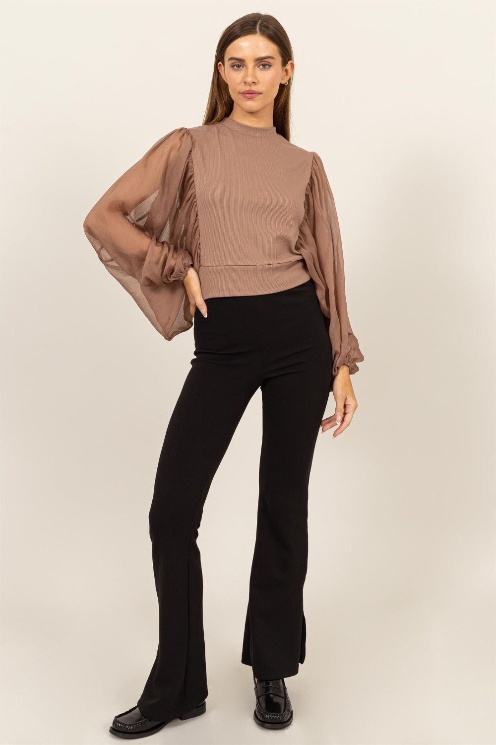 HYFVE Ruched Sheer Long Sleeve Mock Neck Blouse featuring delicate sheer sleeves and a back button closure, perfect for casual and formal occasions.