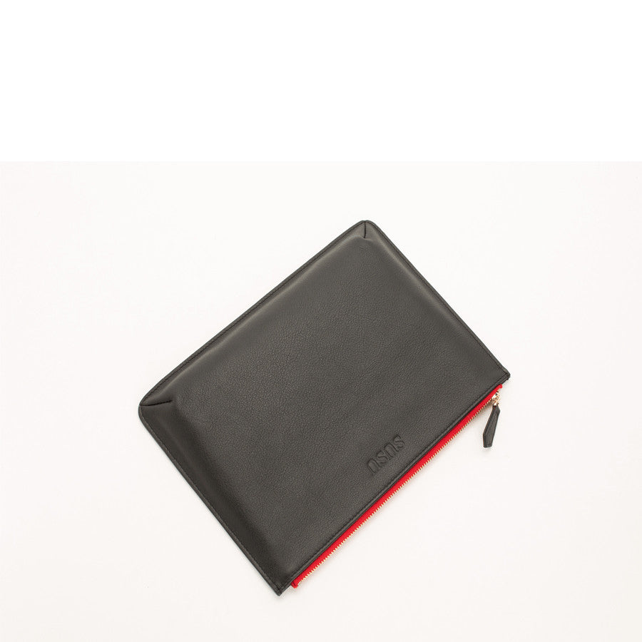 Elegant black leather iPad clutch case with pebbled texture, designed to protect and stylishly carry your iPad.