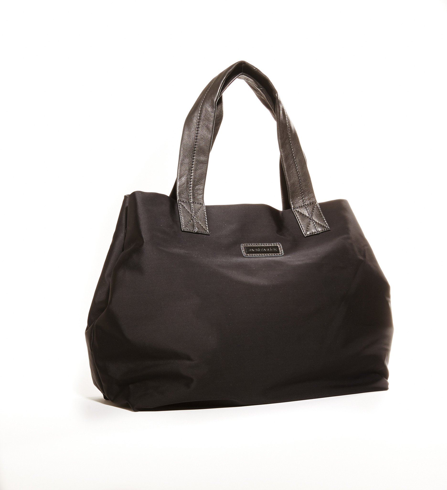 Jacki Easlick Black Basic Travel Tote featuring cowhide leather trim and waterproof nylon material, perfect for stylish travel.