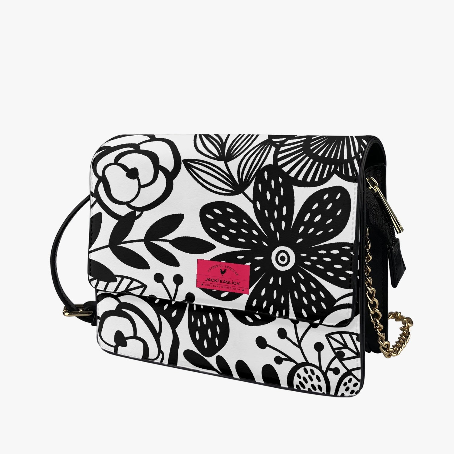 Jacki Easlick Happy Flowers Flap Handbag made of leather, featuring a floral design, adjustable strap, and magnetic closure.