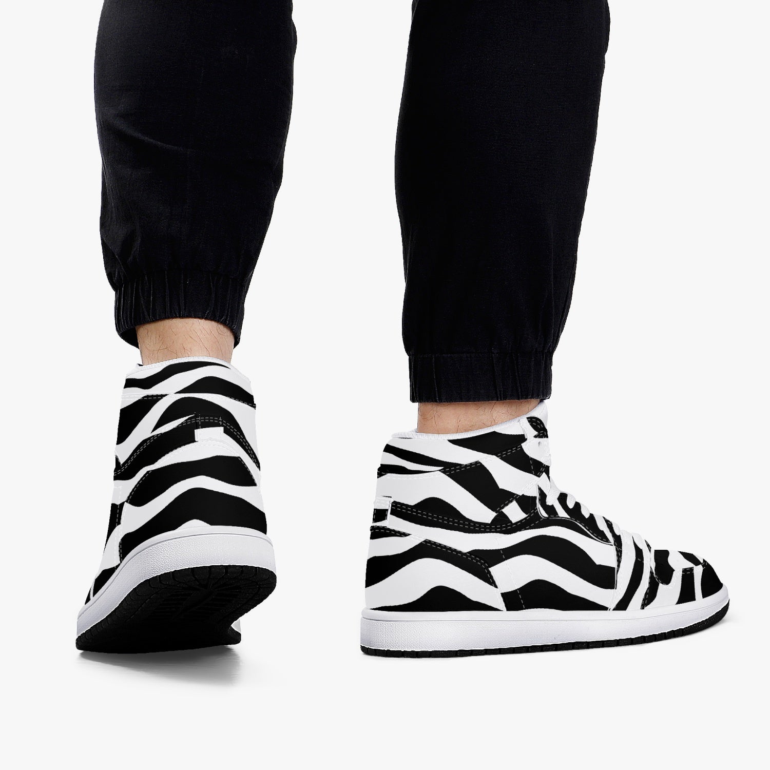 Jacki Easlick Zebra High-Top Leather Sneakers showcasing a stylish zebra print design with a durable leather upper.