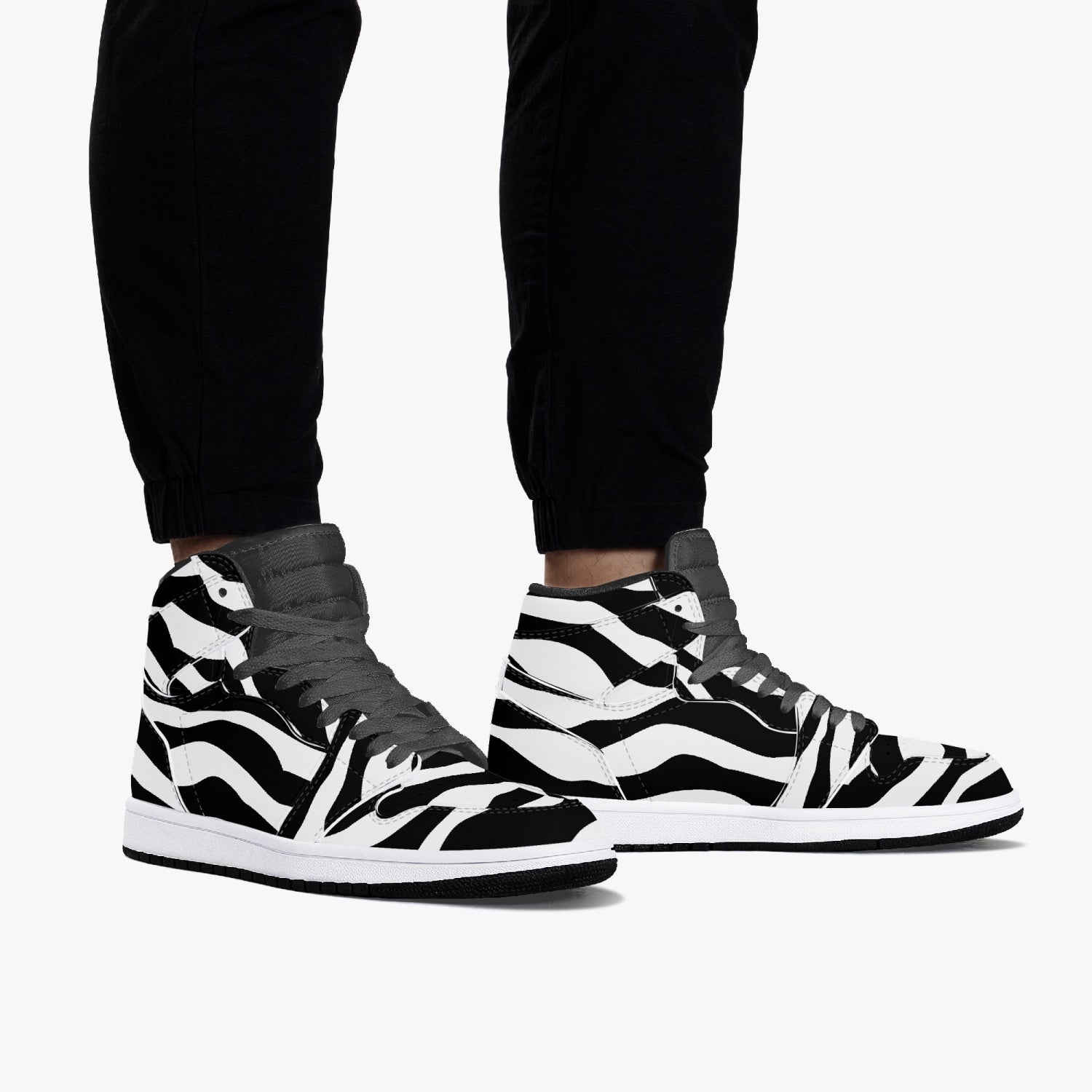 Jacki Easlick Zebra High-Top Leather Sneakers showcasing a stylish zebra print design with a durable leather upper.