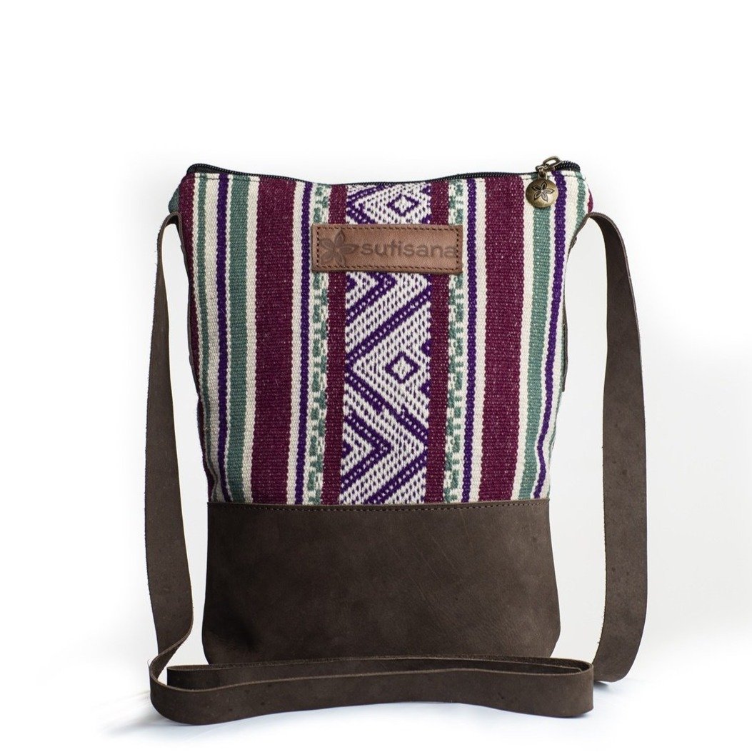 Jaunty Crossbody bag in vibrant dahlia color with zippered pocket, perfect for stylish outings.