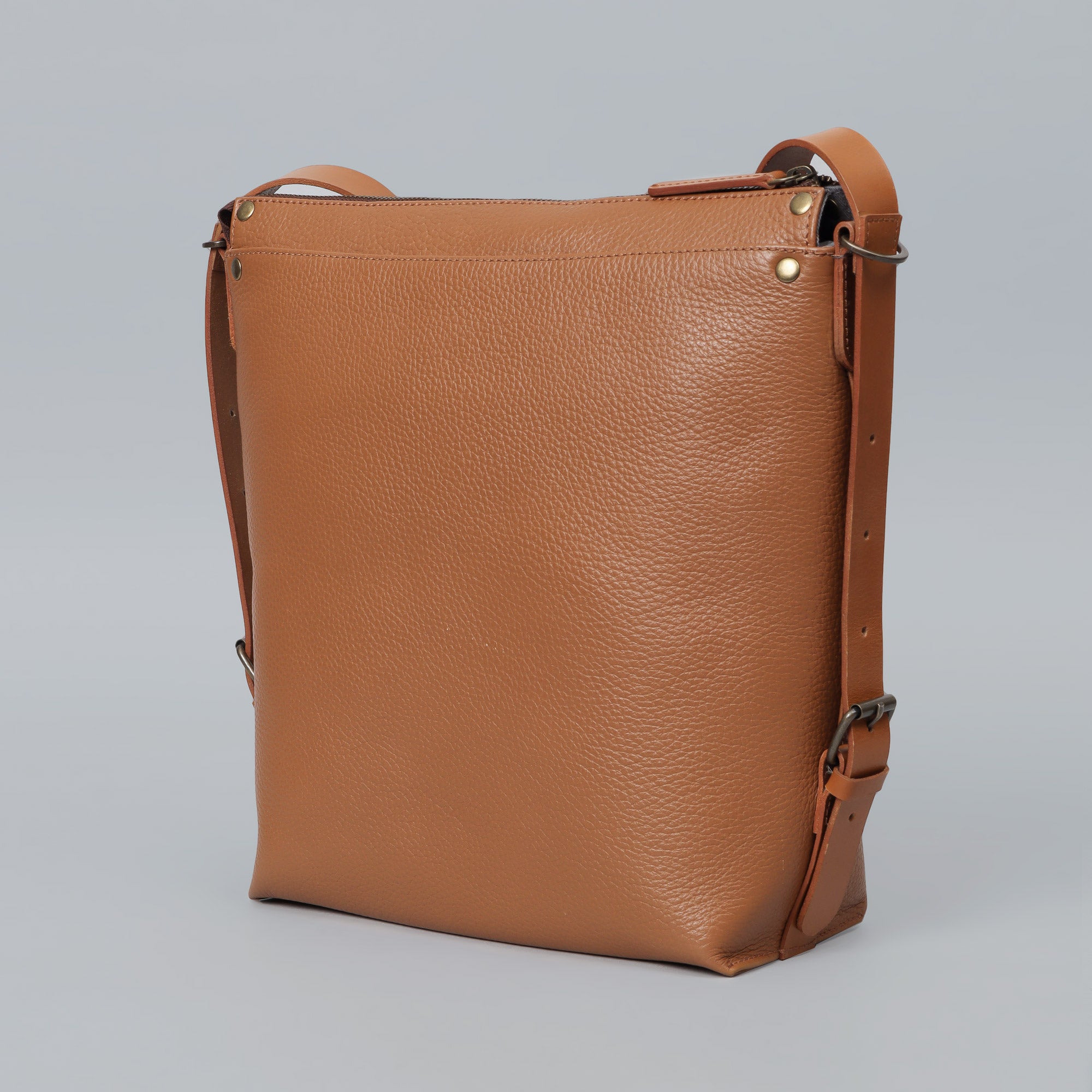 Jersey Leather Crossbody Bag showcasing premium full grain leather, adjustable strap, and multiple pockets for organization.