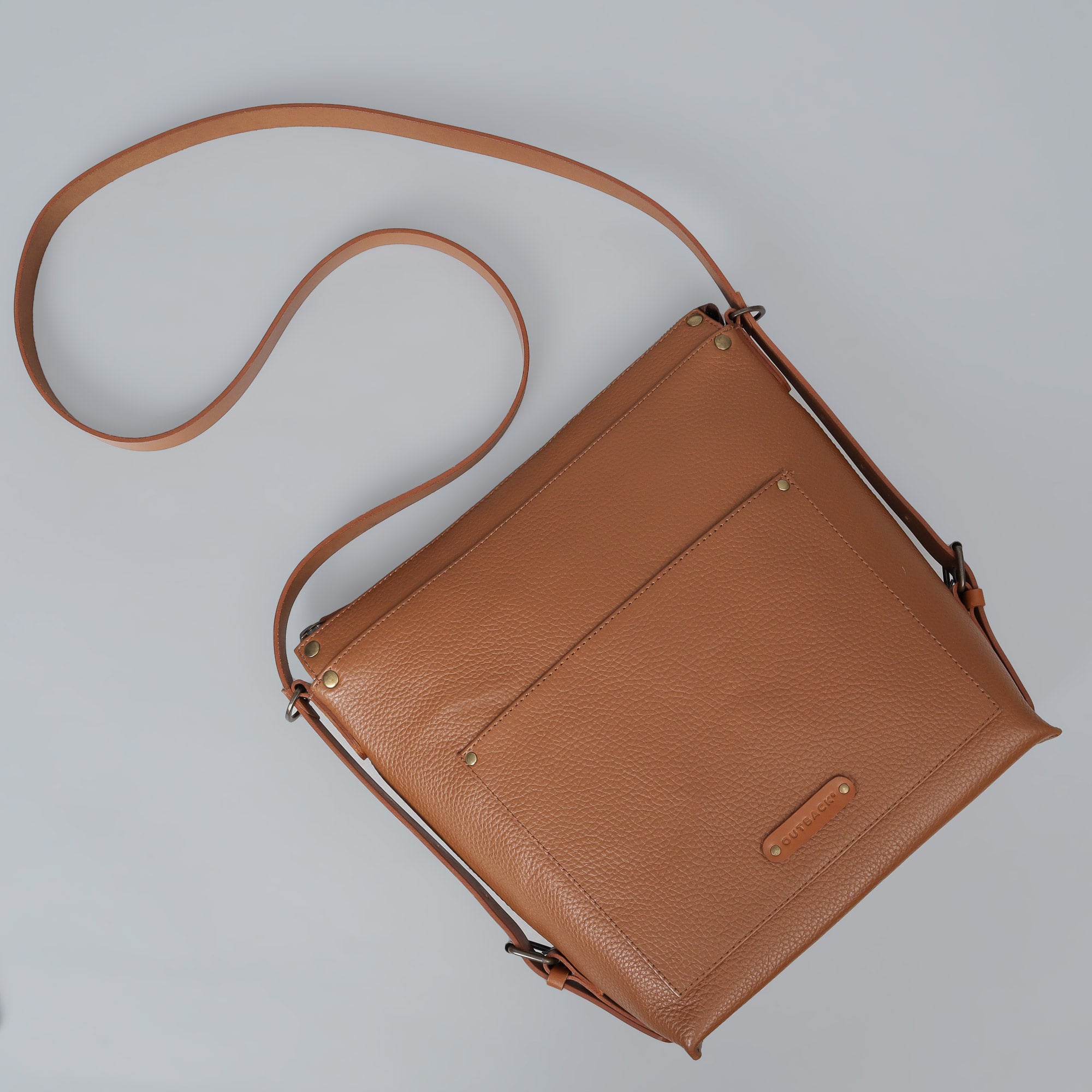 Jersey Leather Crossbody Bag showcasing premium full grain leather, adjustable strap, and multiple pockets for organization.