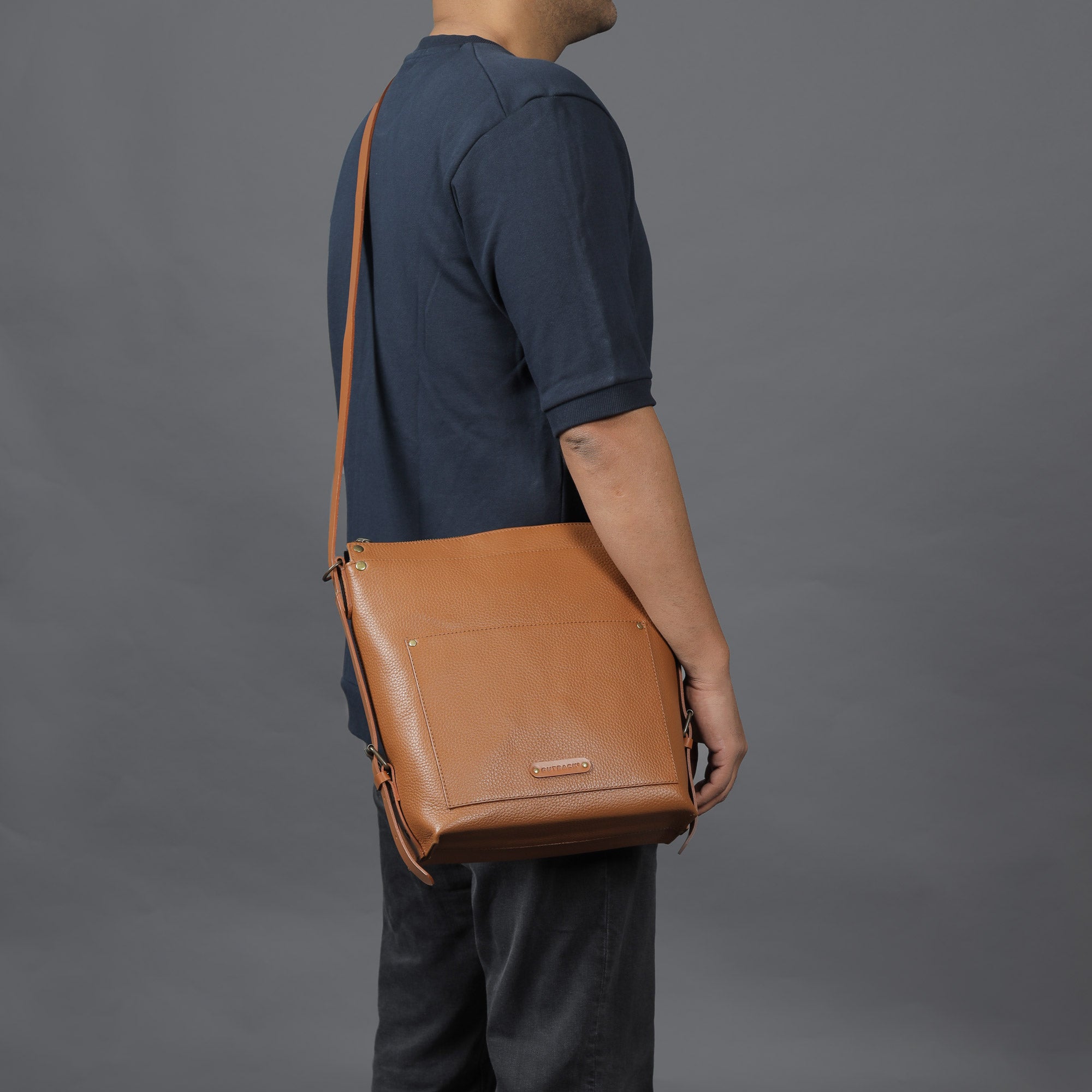 Jersey Leather Crossbody Bag showcasing premium full grain leather, adjustable strap, and multiple pockets for organization.