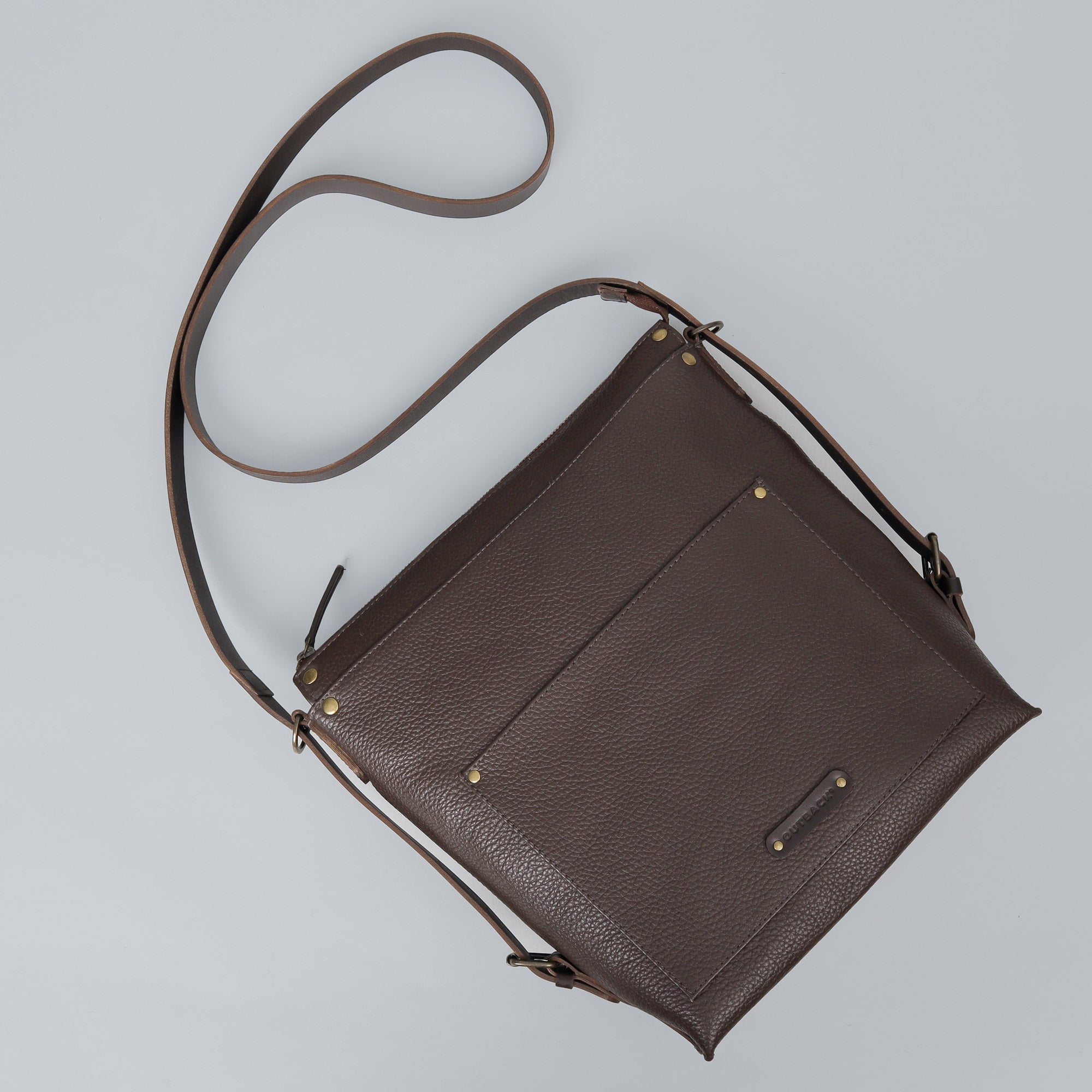 Jersey Leather Crossbody Bag showcasing premium full grain leather, adjustable strap, and multiple pockets for organization.