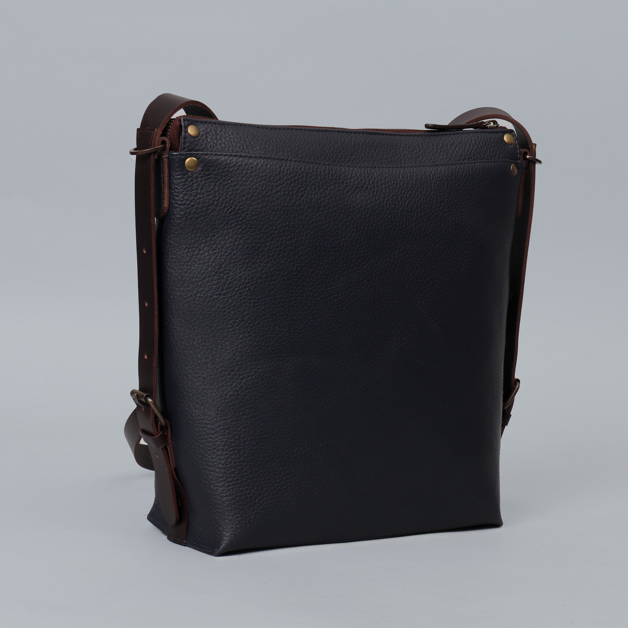 Jersey Leather Crossbody Bag showcasing premium full grain leather, adjustable strap, and multiple storage compartments.