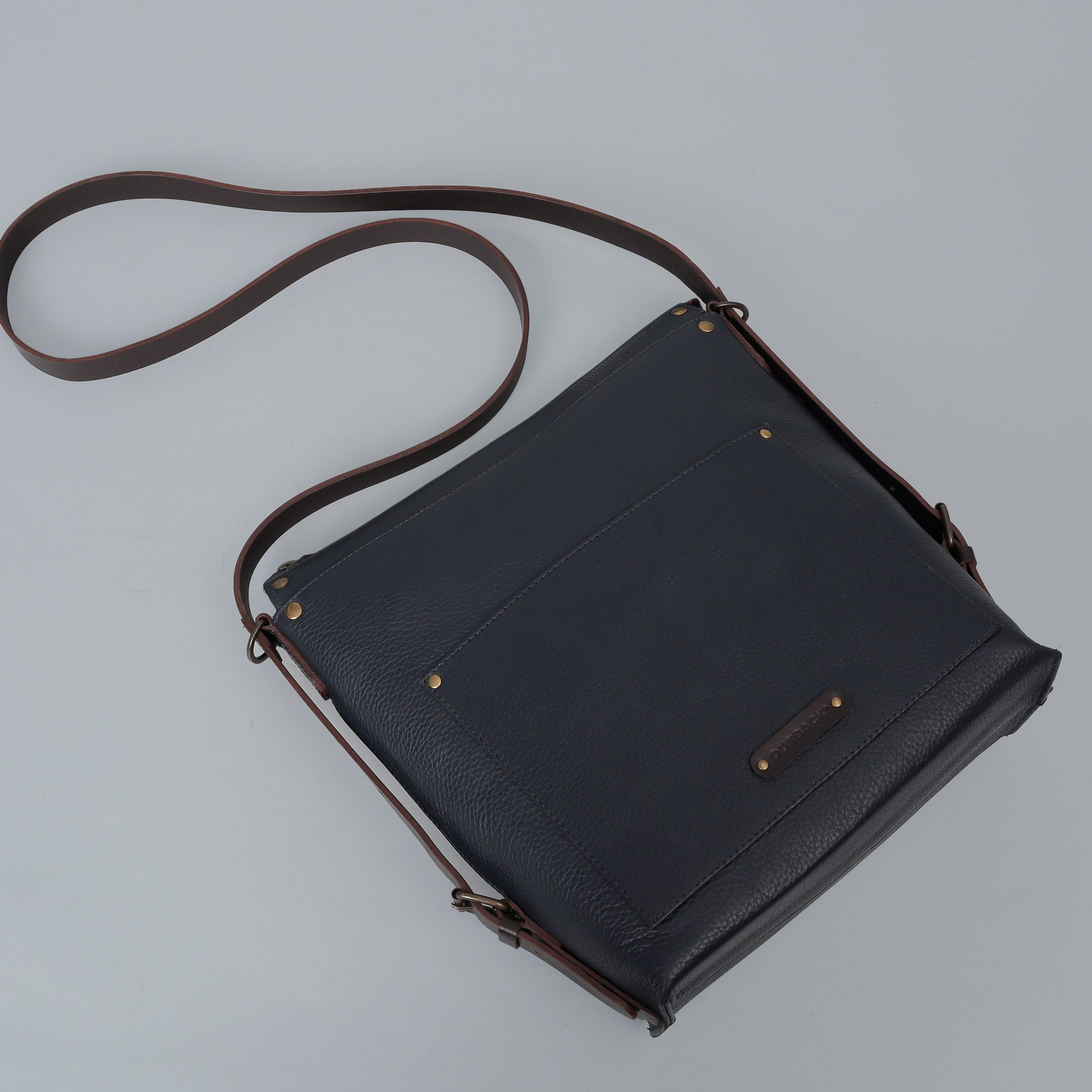 Jersey Leather Crossbody Bag showcasing premium full grain leather, adjustable strap, and multiple storage compartments.