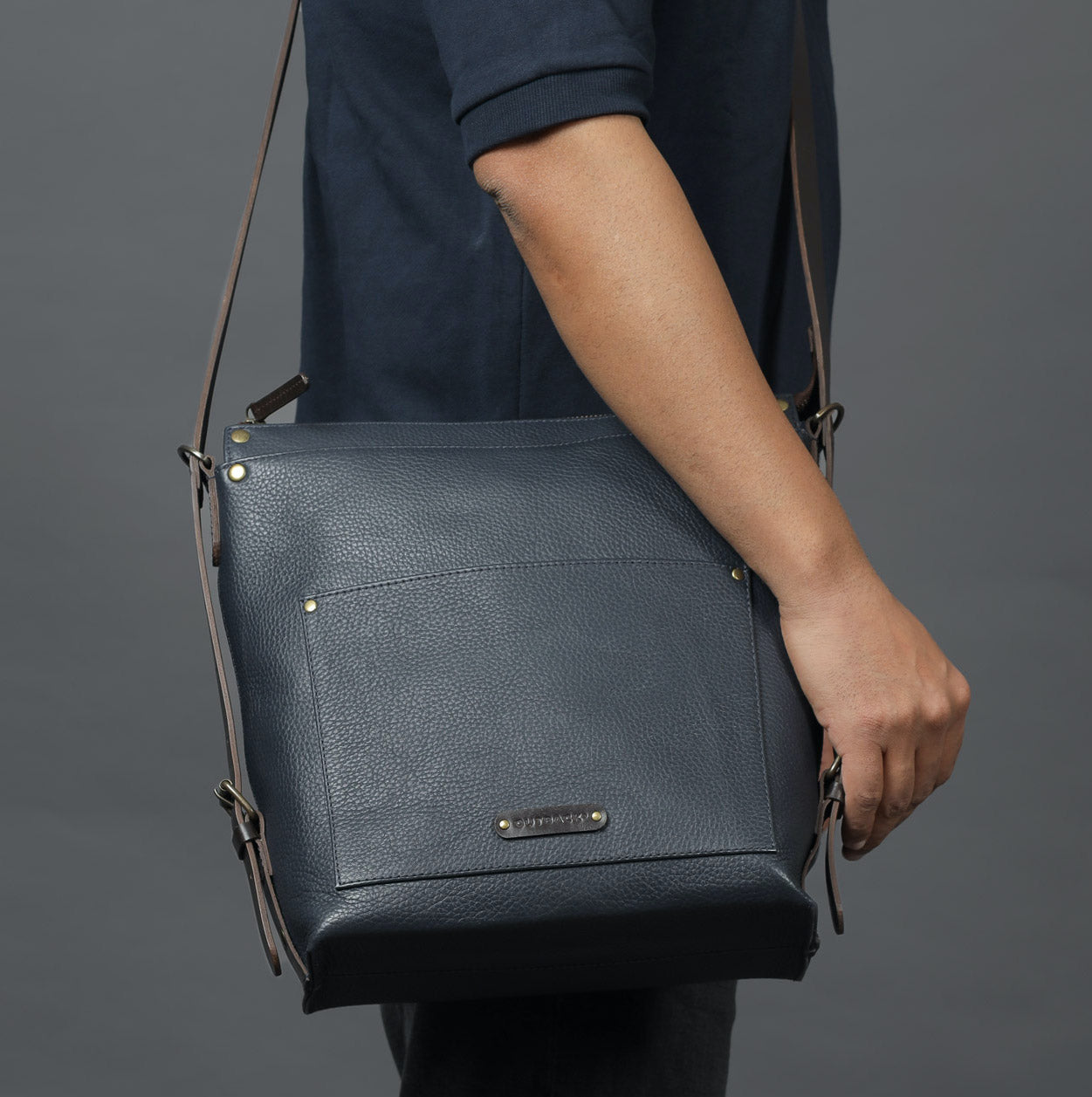 Jersey Leather Crossbody Bag showcasing premium full grain leather, adjustable strap, and multiple storage compartments.