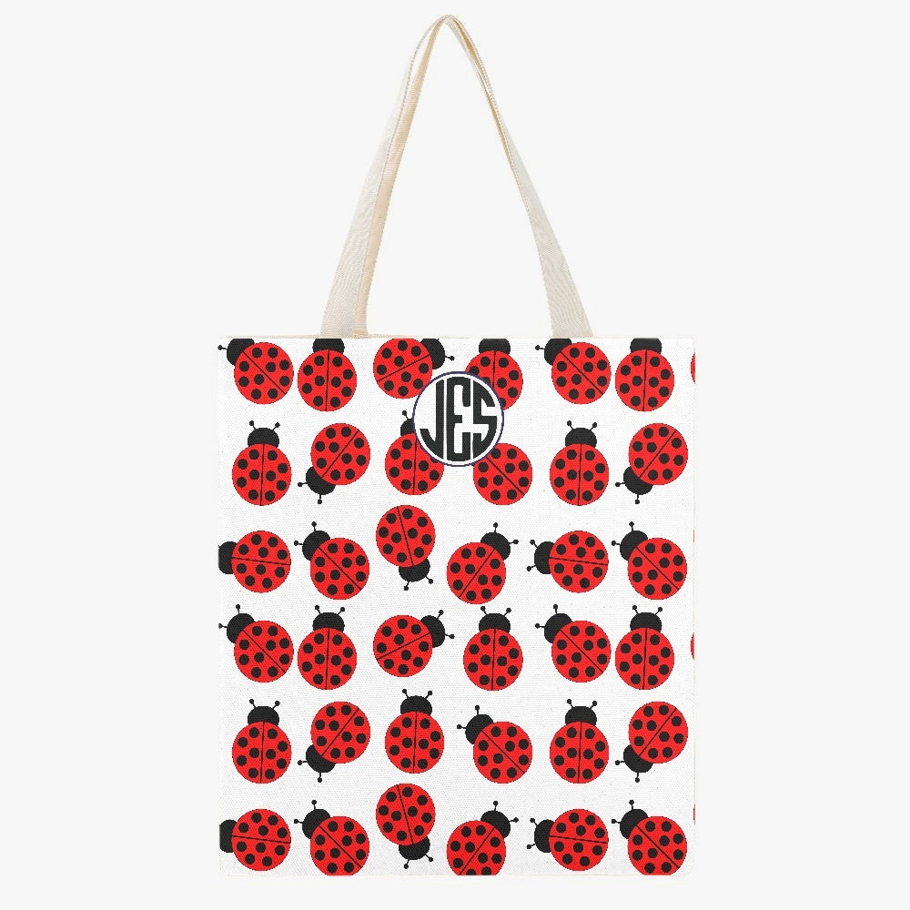 JES Canvas Tote Bag featuring a stylish one-side print, made of durable canvas material, perfect for beach and everyday use.