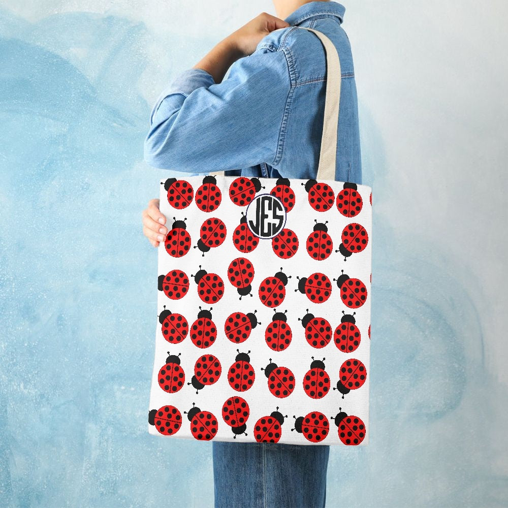 JES Canvas Tote Bag featuring a stylish one-side print, made of durable canvas material, perfect for beach and everyday use.