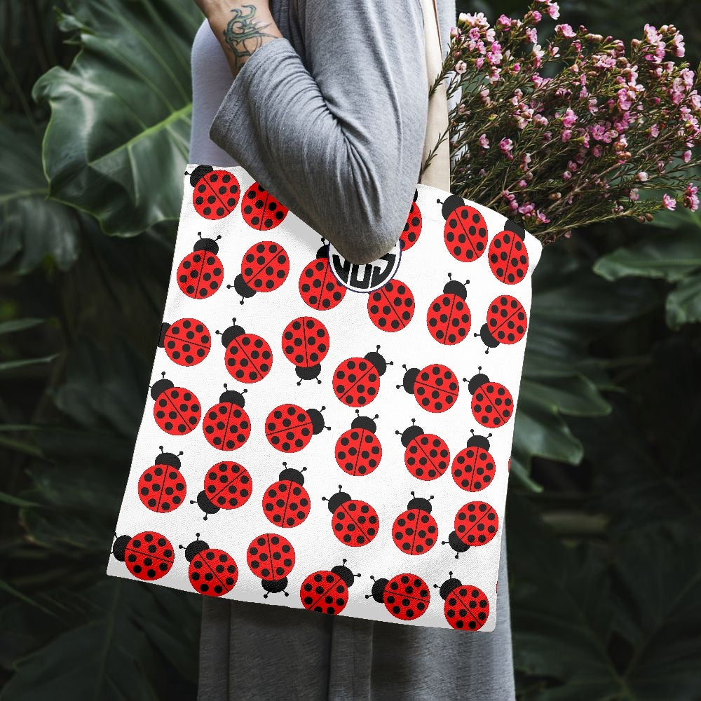 JES Canvas Tote Bag featuring a stylish one-side print, made of durable canvas material, perfect for beach and everyday use.