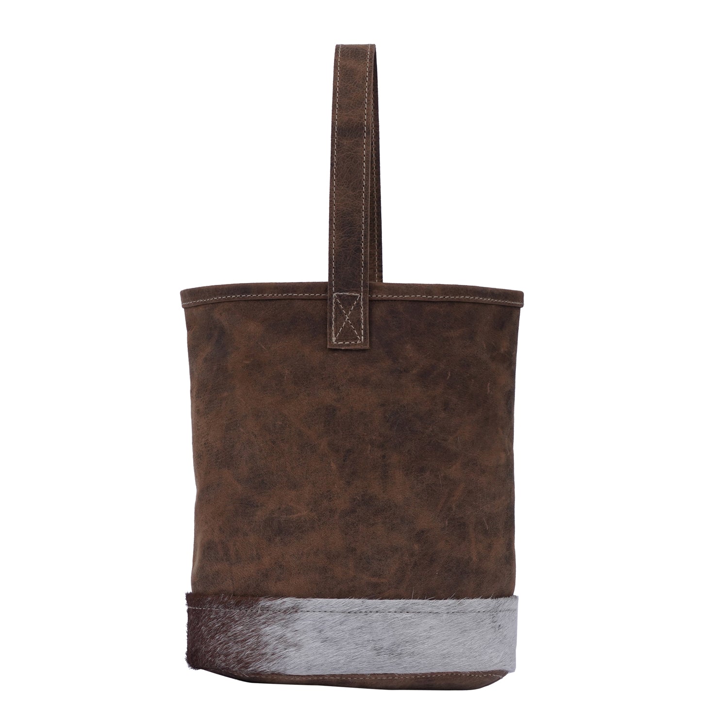 Handmade leather bottle cover with hairon material and strong handle, showcasing unique craftsmanship.