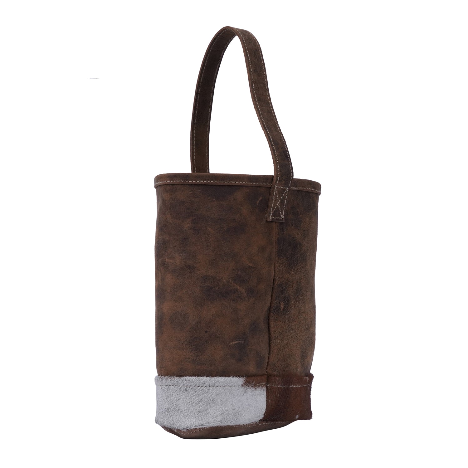 Handmade leather bottle cover with hairon material and strong handle, showcasing unique craftsmanship.