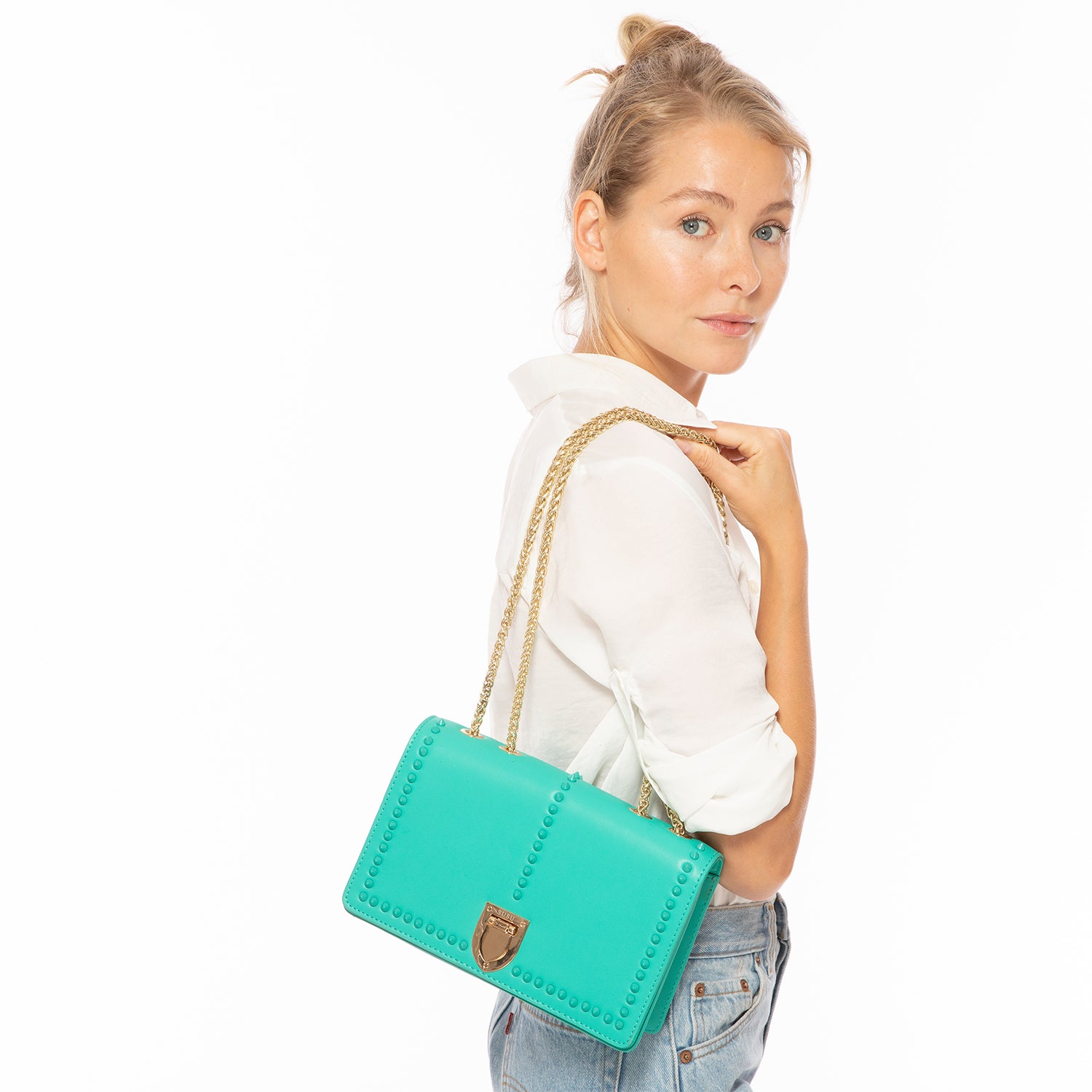 Josie Green Leather Bag with Chain Strap featuring decorative studs and a stylish design.