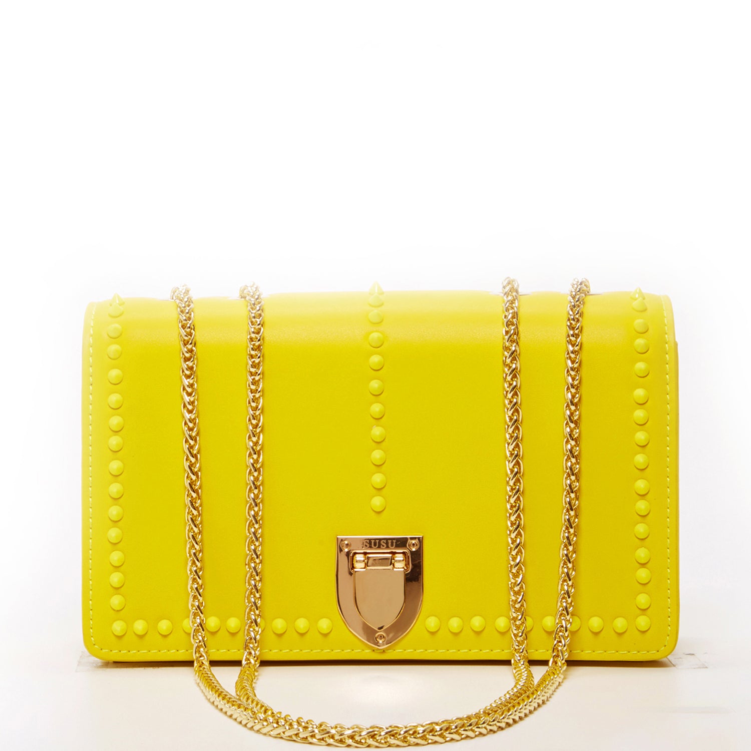 Josie Mustard Yellow Leather Purse with decorative studs and gold chain strap, showcasing its stylish design and functional features.