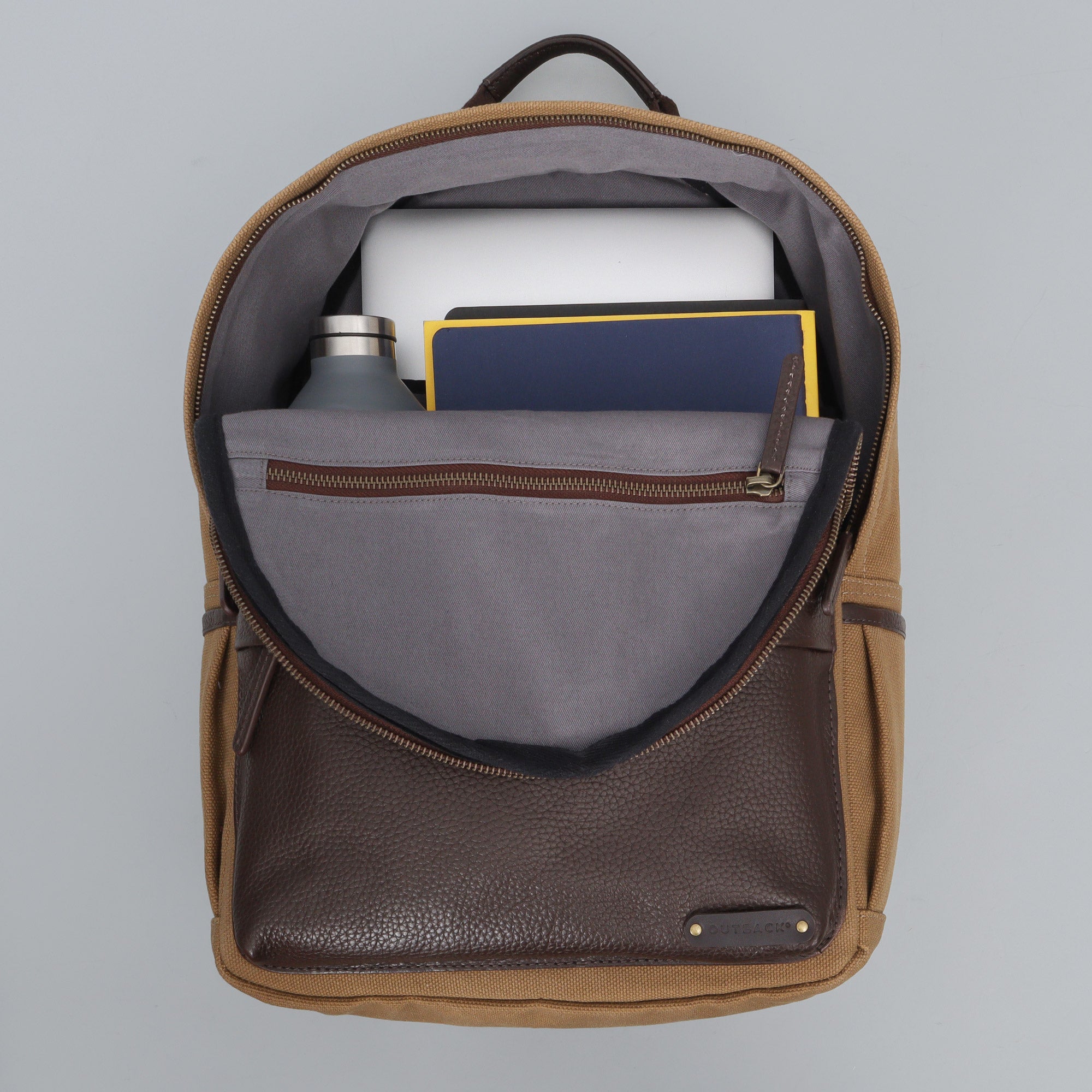 Journey Canvas Backpack featuring padded laptop section, multiple pockets, and durable water-resistant material.